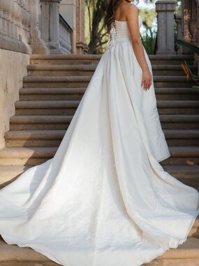 White skirt with a long train with lace detailing